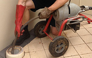 Pete is using the power auger on a drain cleaning in Ellicott City